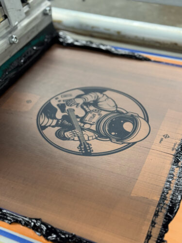 The black screen during traditional screen printing.